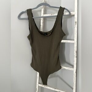 NWOT-  Wild fable olive green tank body suit with riffle hem size medium.